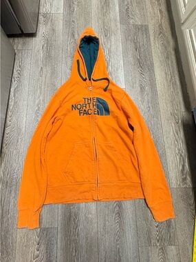 The North Face Orange Hoodie with Dark Teal Logo